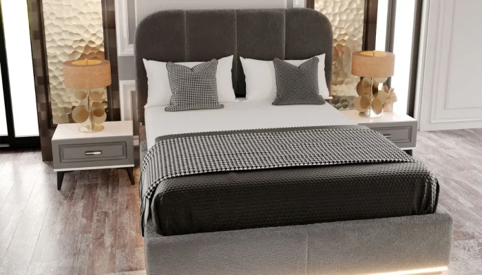 Mona Yatak Takımı'nın yakın çekimi. Gri döşemeli yatak, ekose ve siyah kapitone battaniyeli yastıklar, iki adet komodin ve altın renkli şık lambalar.